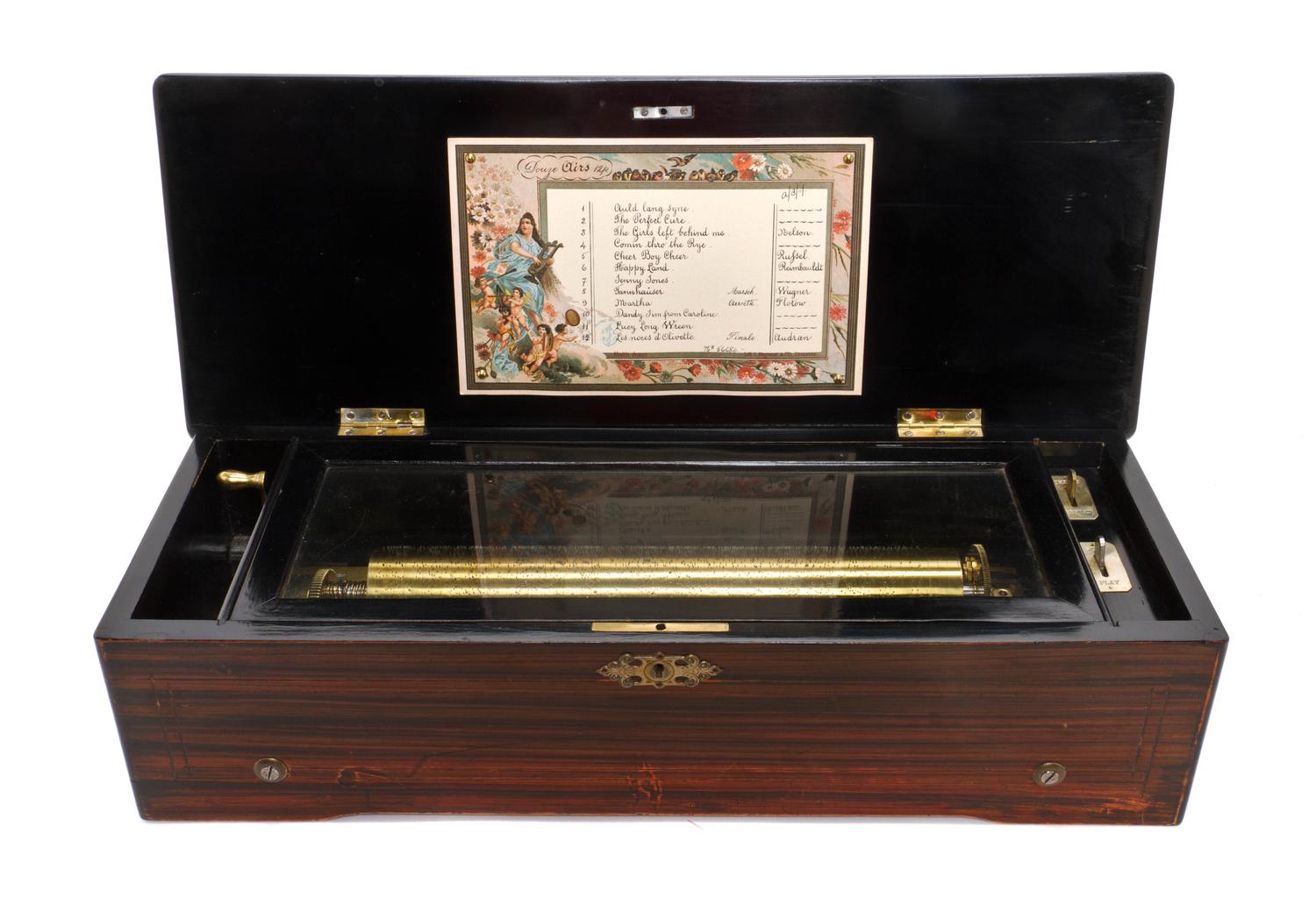 A Swiss Marquetry Cylinder Music Box, Height 6 x width 22 1/2 x depth 9 inches.
