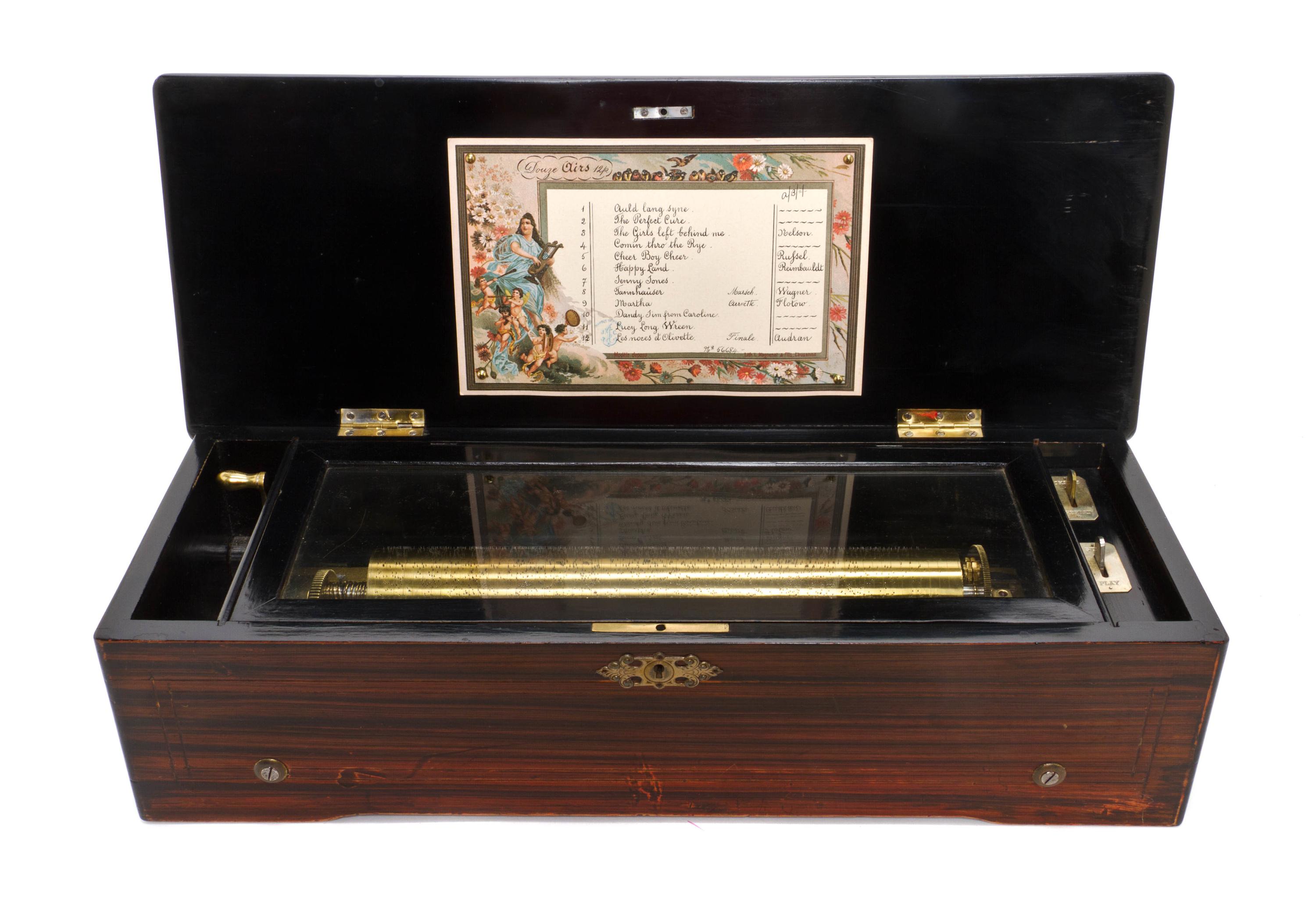 A Swiss Marquetry Cylinder Music Box, Height 6 x width 22 1/2 x depth 9 inches.