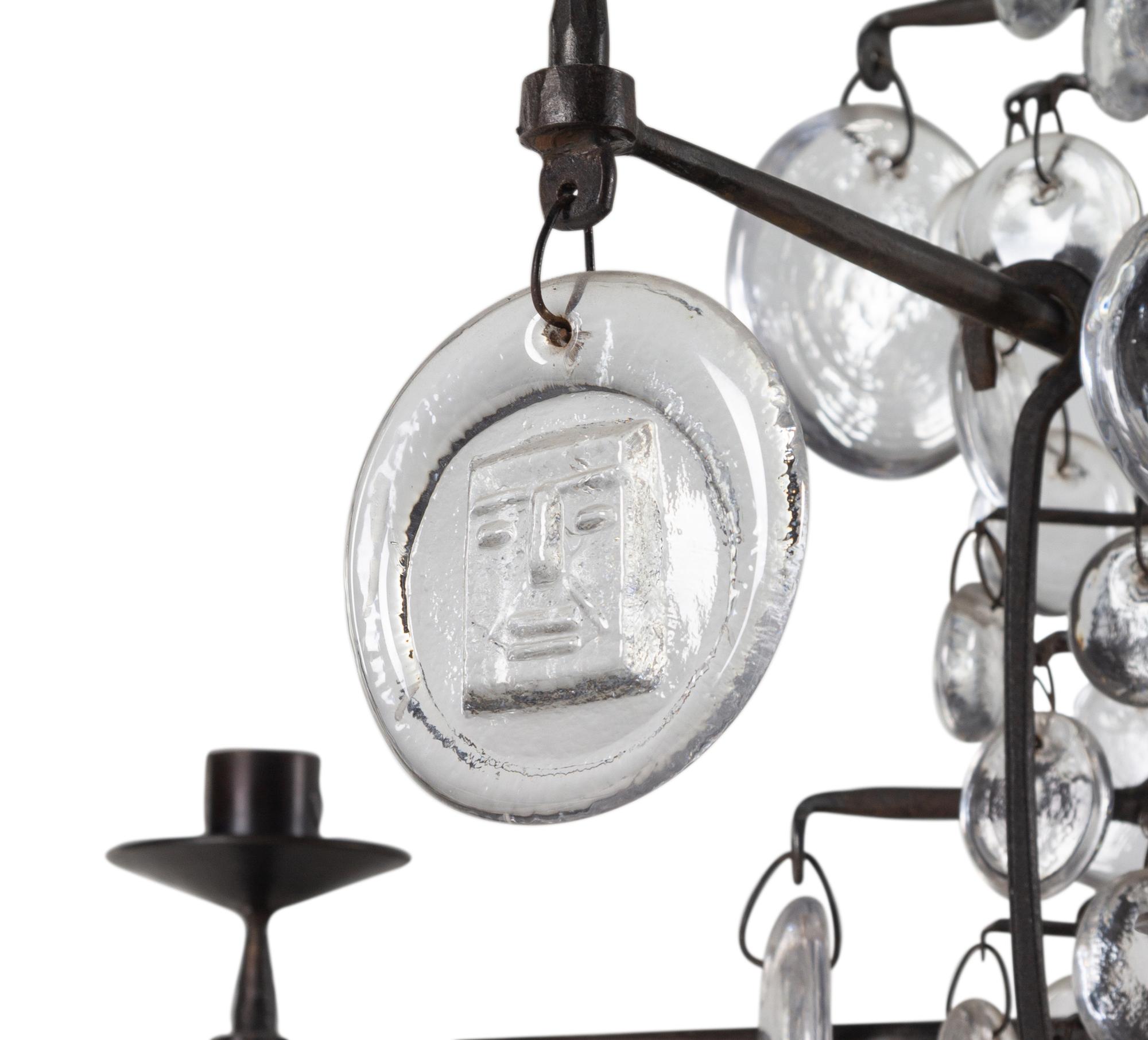 A Swedish Wrought Iron and Molded Glass Twelve-Light Chandelier