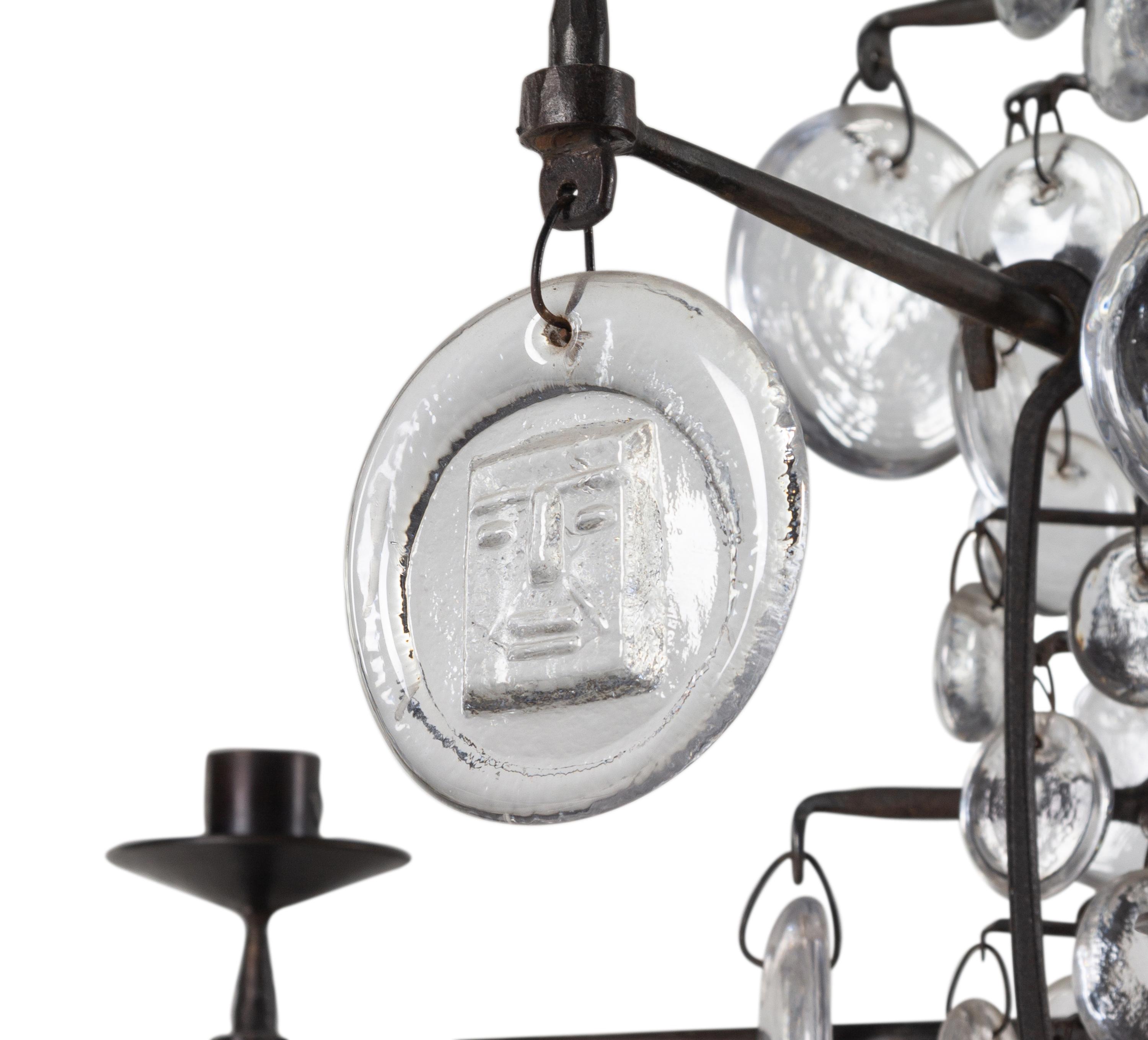 A Swedish Wrought Iron and Molded Glass Twelve-Light Chandelier