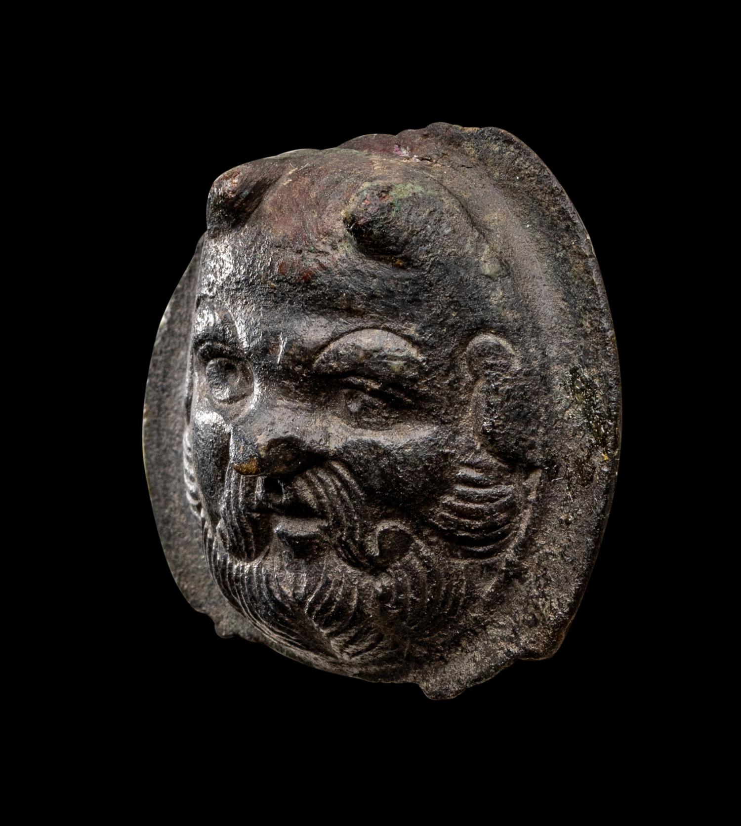 A Roman Bronze Boss with the Head of a Satyr
