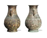 A pair of patinated bronze archaistic large vases