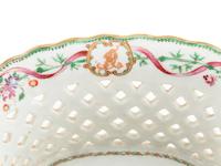 A Chinese Export Armorial Porcelain Reticulated Basket and Underplate