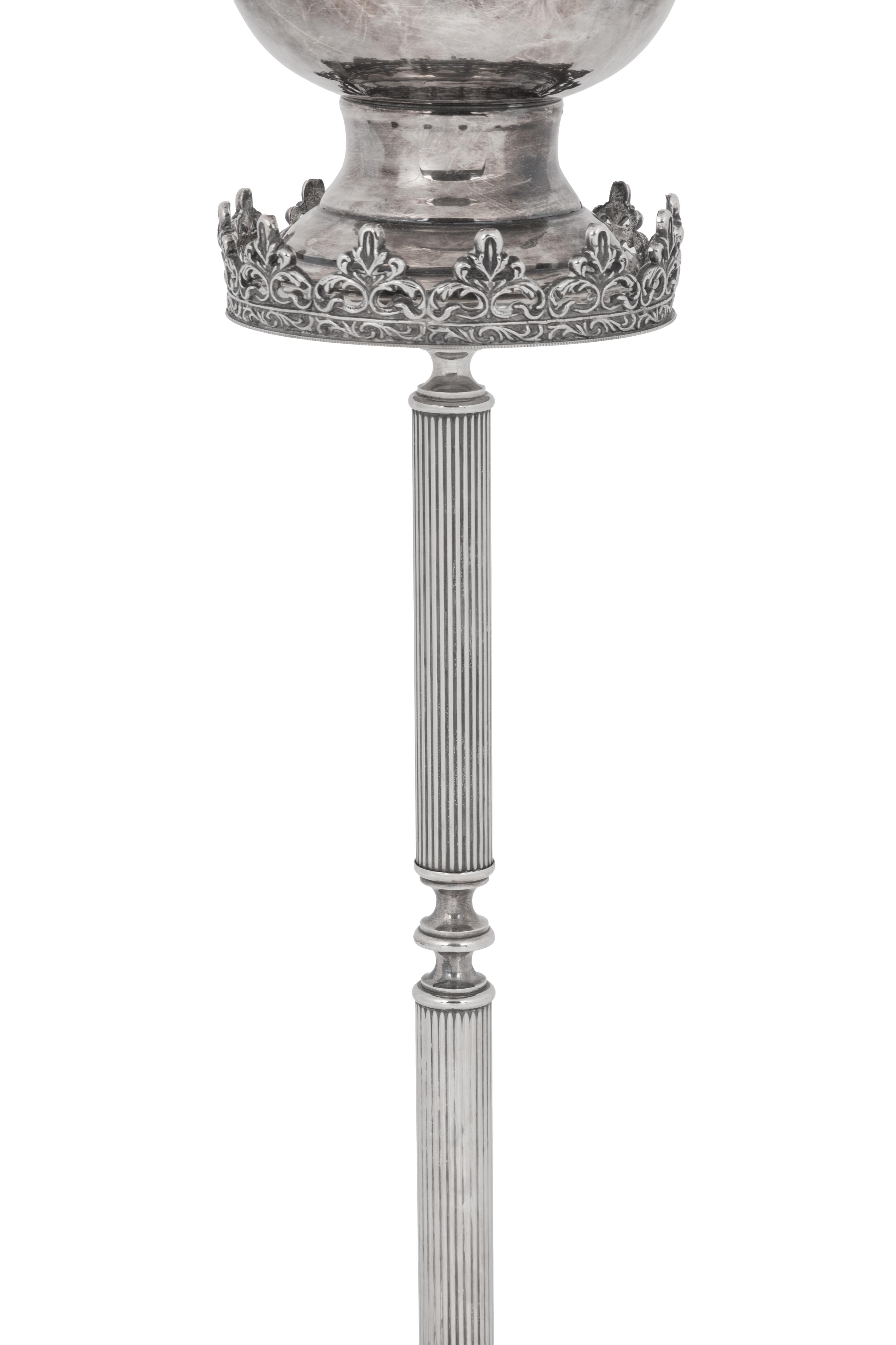 A Silvered Metal Candle Stand