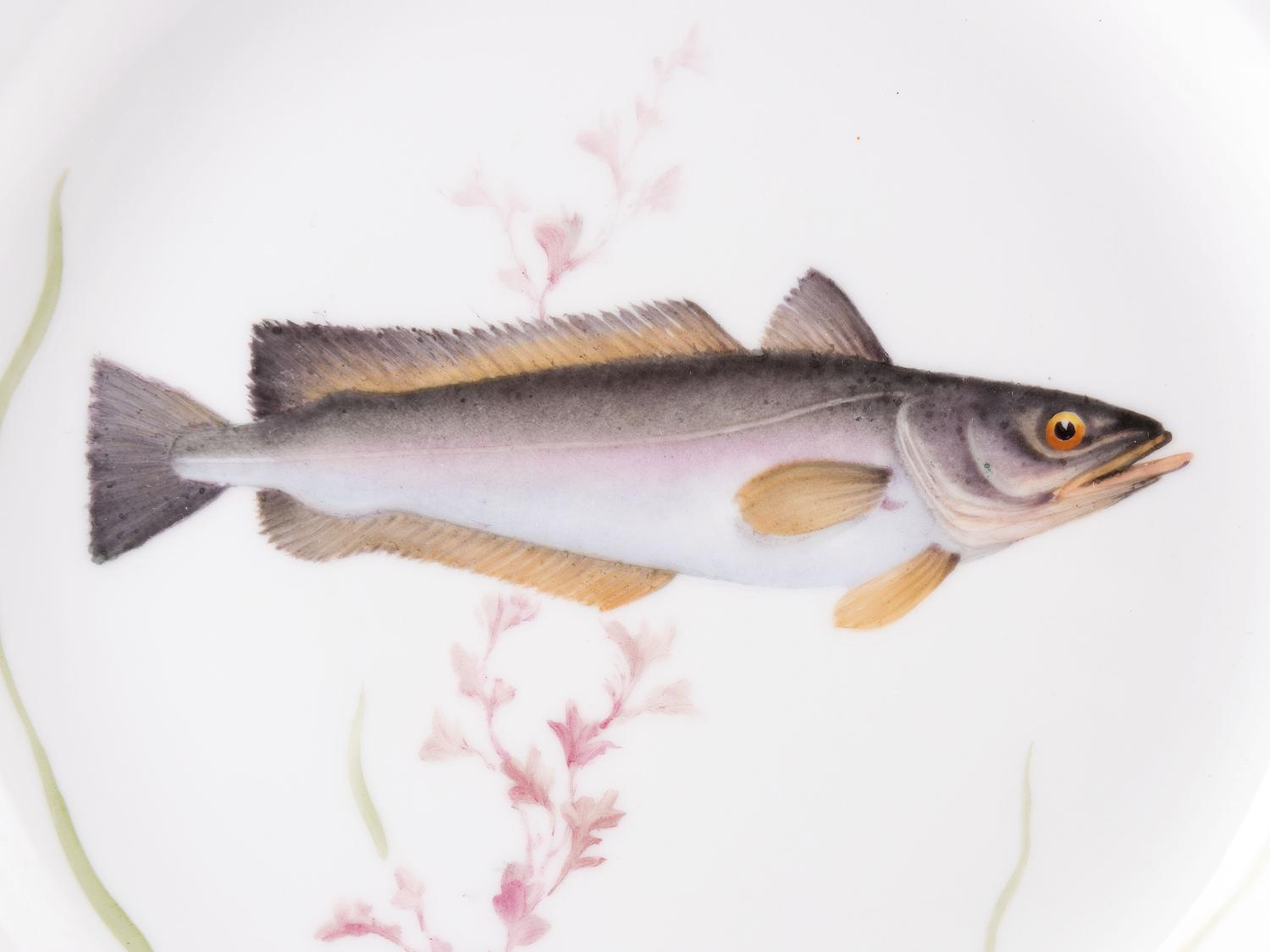 A Set of Twelve Royal Copenhagen Parcel Gilt Porcelain Fish Plates