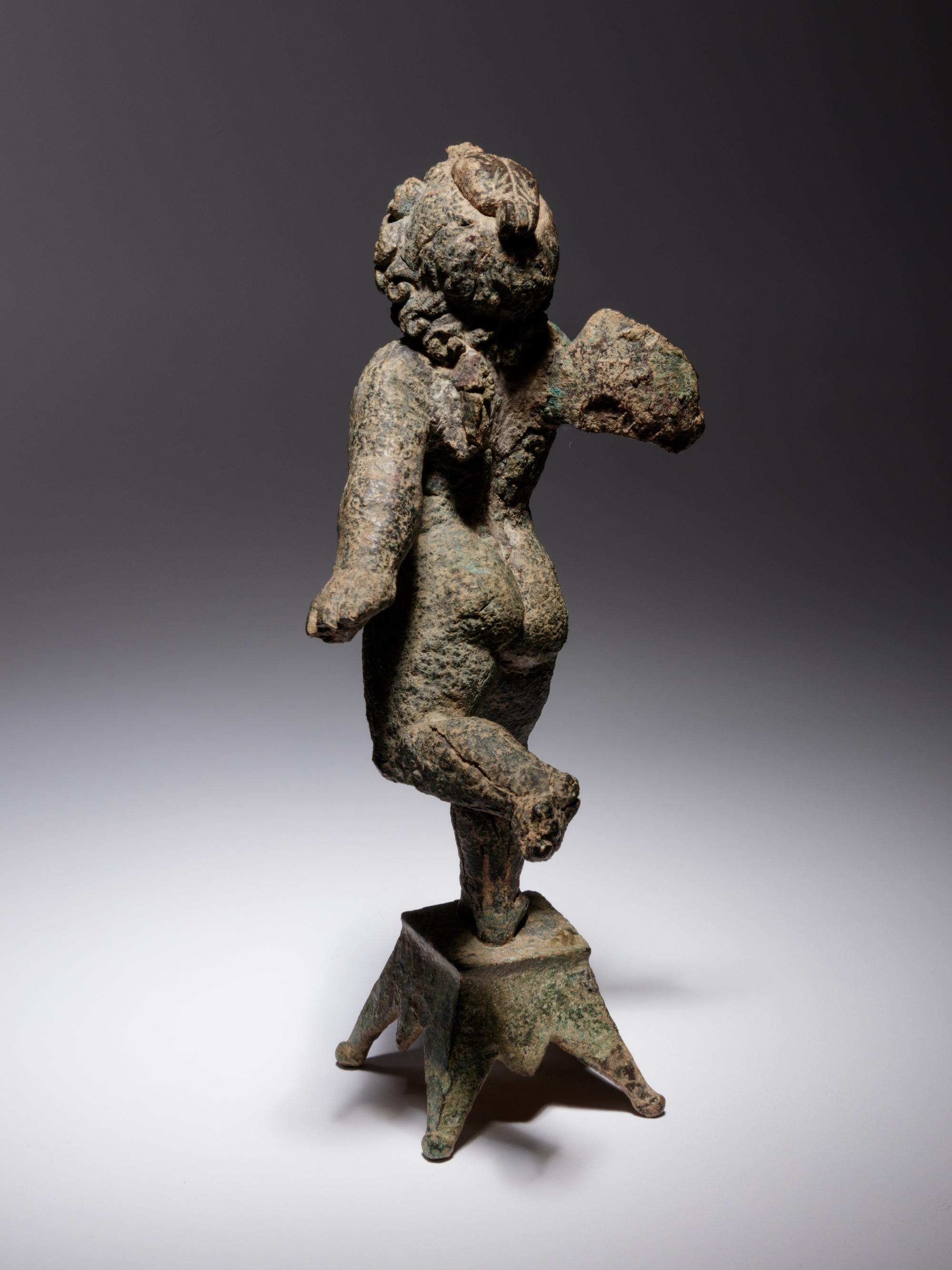 A Roman Bronze Figure of Eros