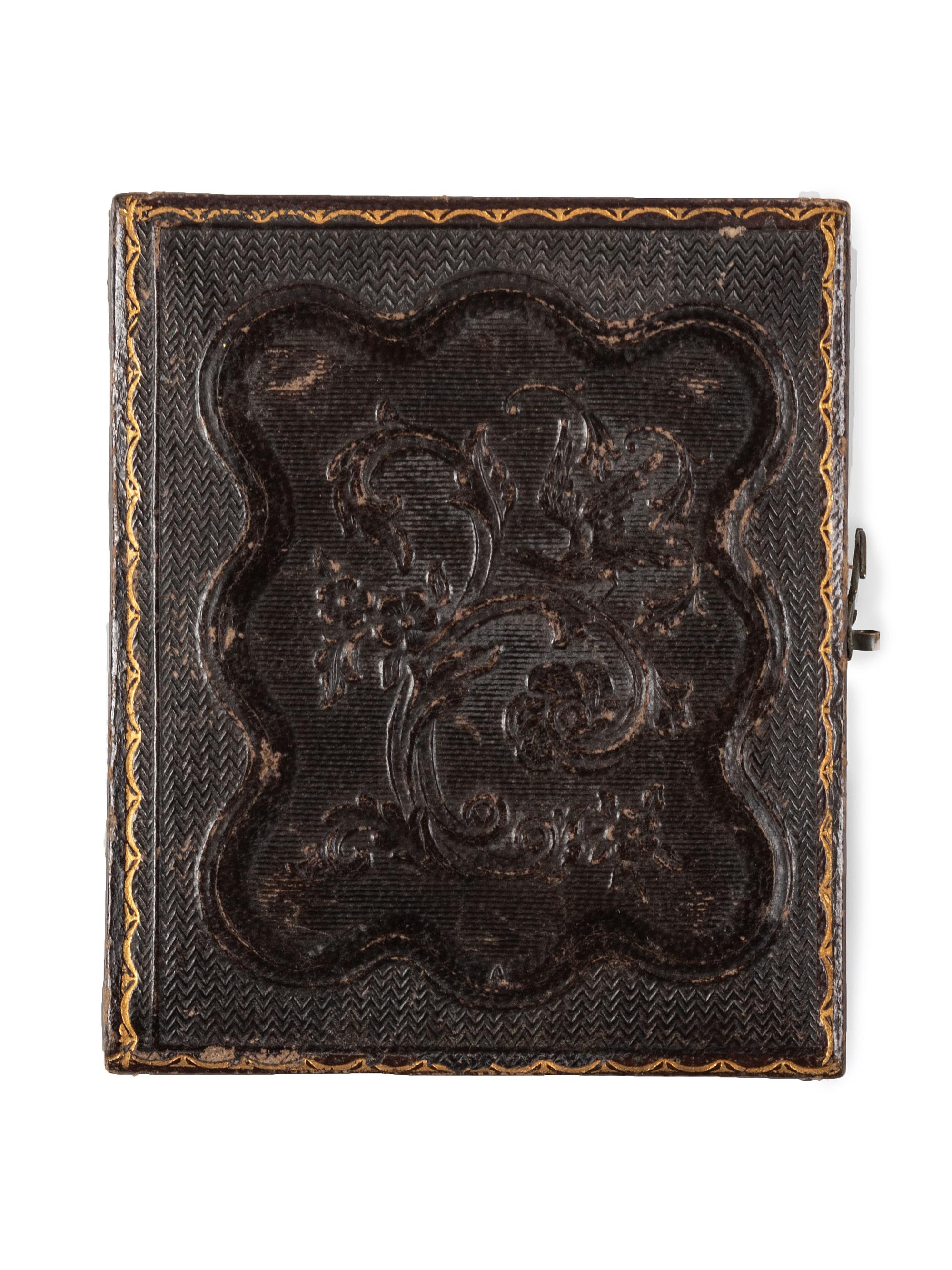 [EARLY PHOTOGRAPHY]. Ninth plate daguerreotype portrait of a man wearing a top hat and holding a revolver to his chest. New York: Holmes, n.d.