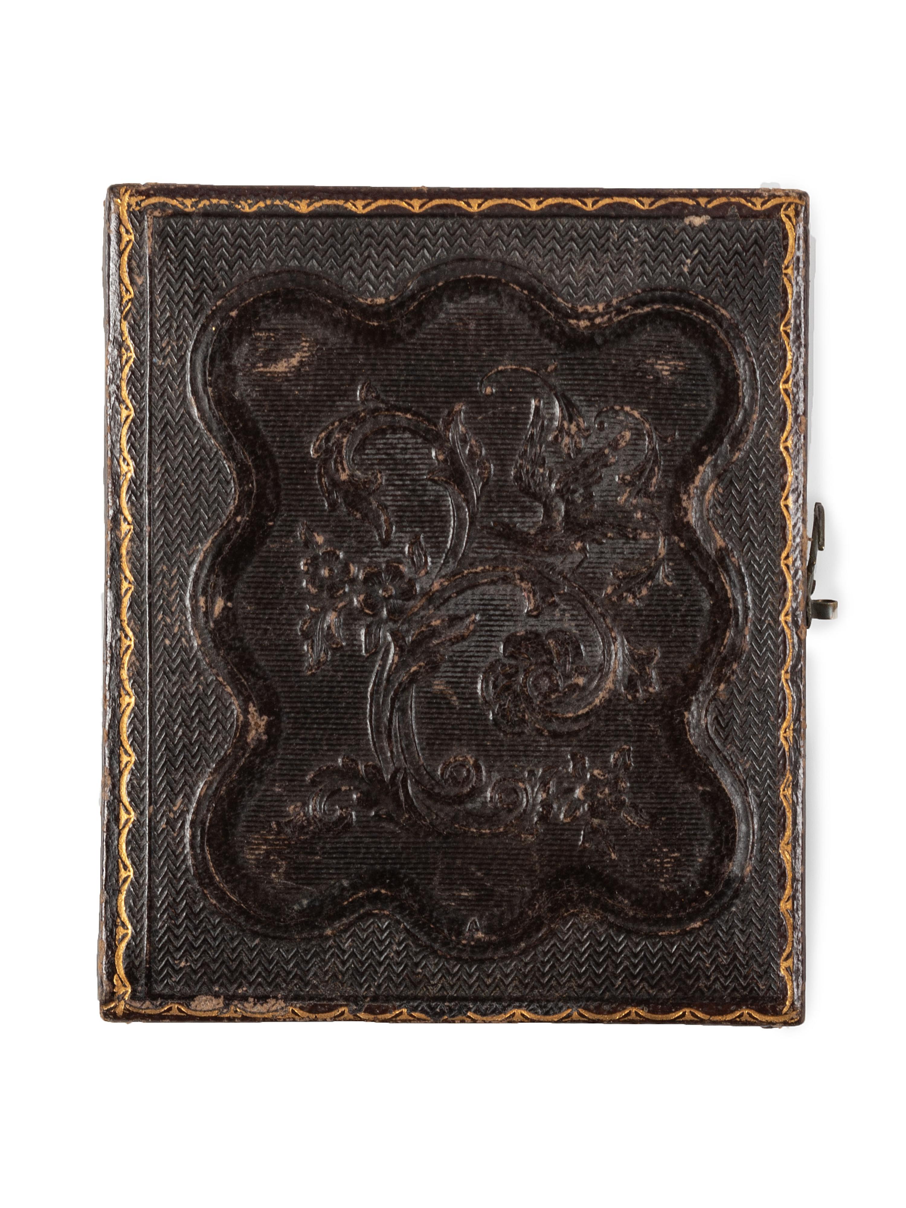 [EARLY PHOTOGRAPHY]. Ninth plate daguerreotype portrait of a man wearing a top hat and holding a revolver to his chest. New York: Holmes, n.d.