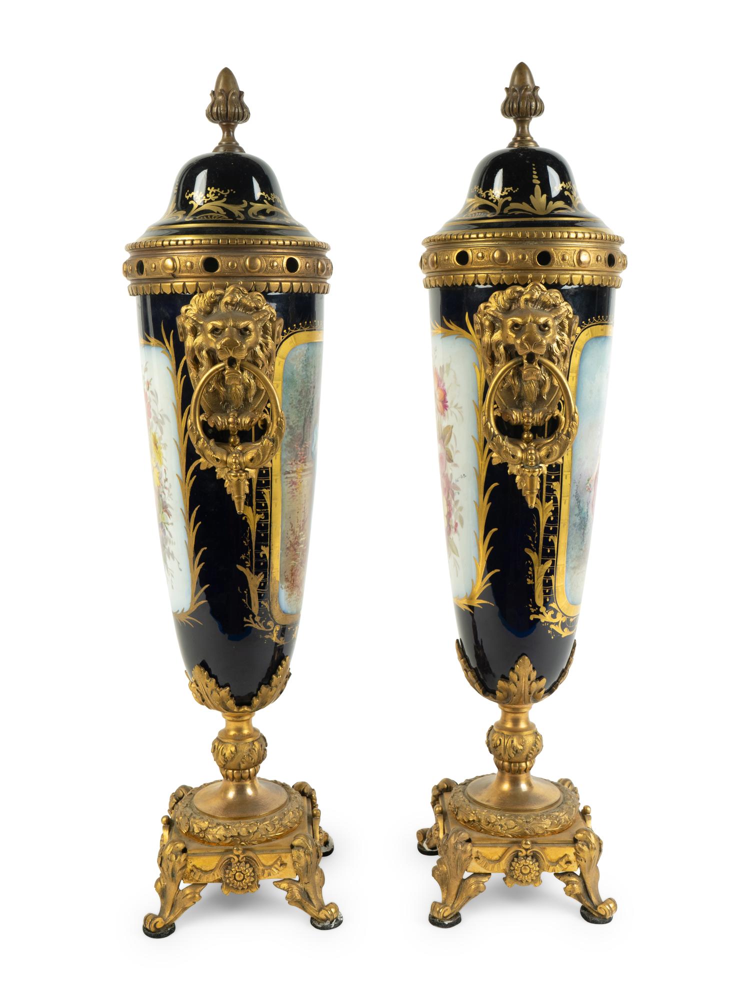 A Pair of Gilt Bronze Mounted Sèvres Style Porcelain Covered Urns — 19TH CENTURY