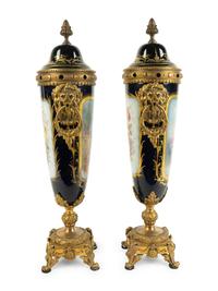 A Pair of Gilt Bronze Mounted Sèvres Style Porcelain Covered Urns — 19TH CENTURY
