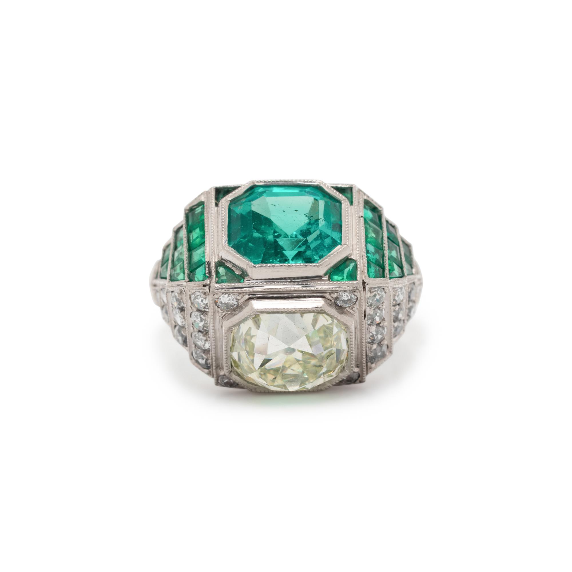 ART DECO, EMERALD AND DIAMOND SCULPTURAL 'TOI ET MOI' RING