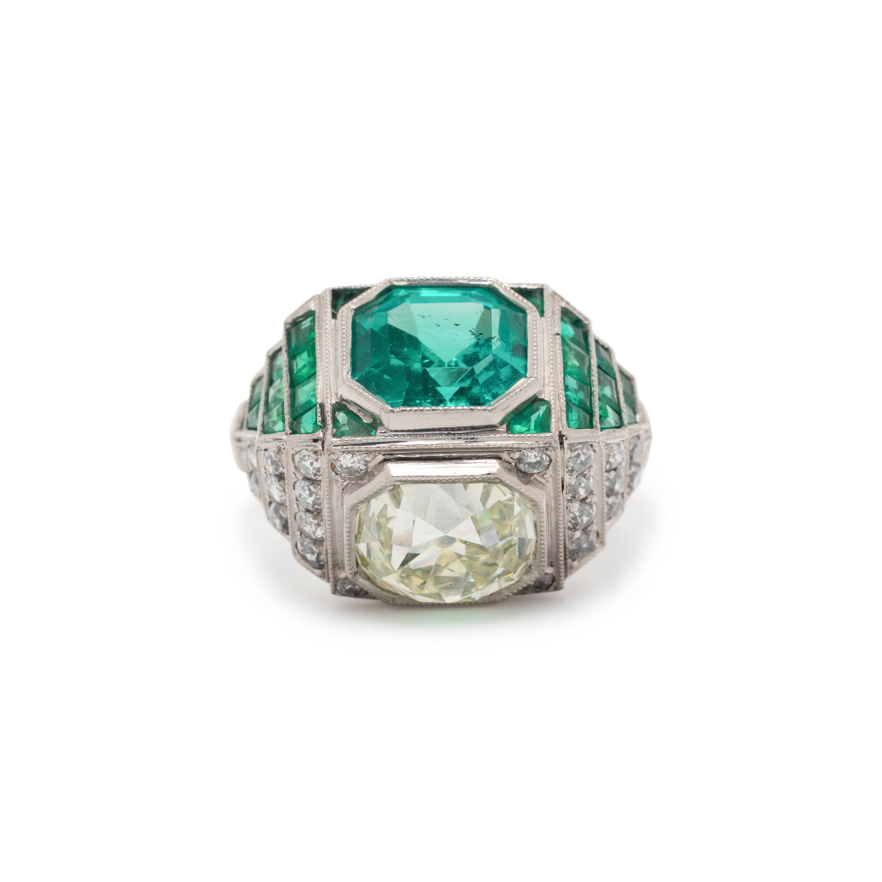 ART DECO, EMERALD AND DIAMOND SCULPTURAL 'TOI ET MOI' RING