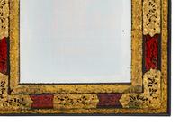 A Flemish Baroque Style Repouséed Brass, Simulated Tortoise and Ebonized Wood Mirror