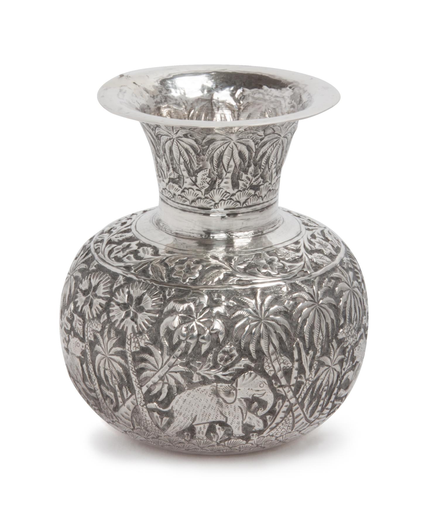 A Burmese Silver Vase, , of squat baluster form, worked to show animals in a jungle.