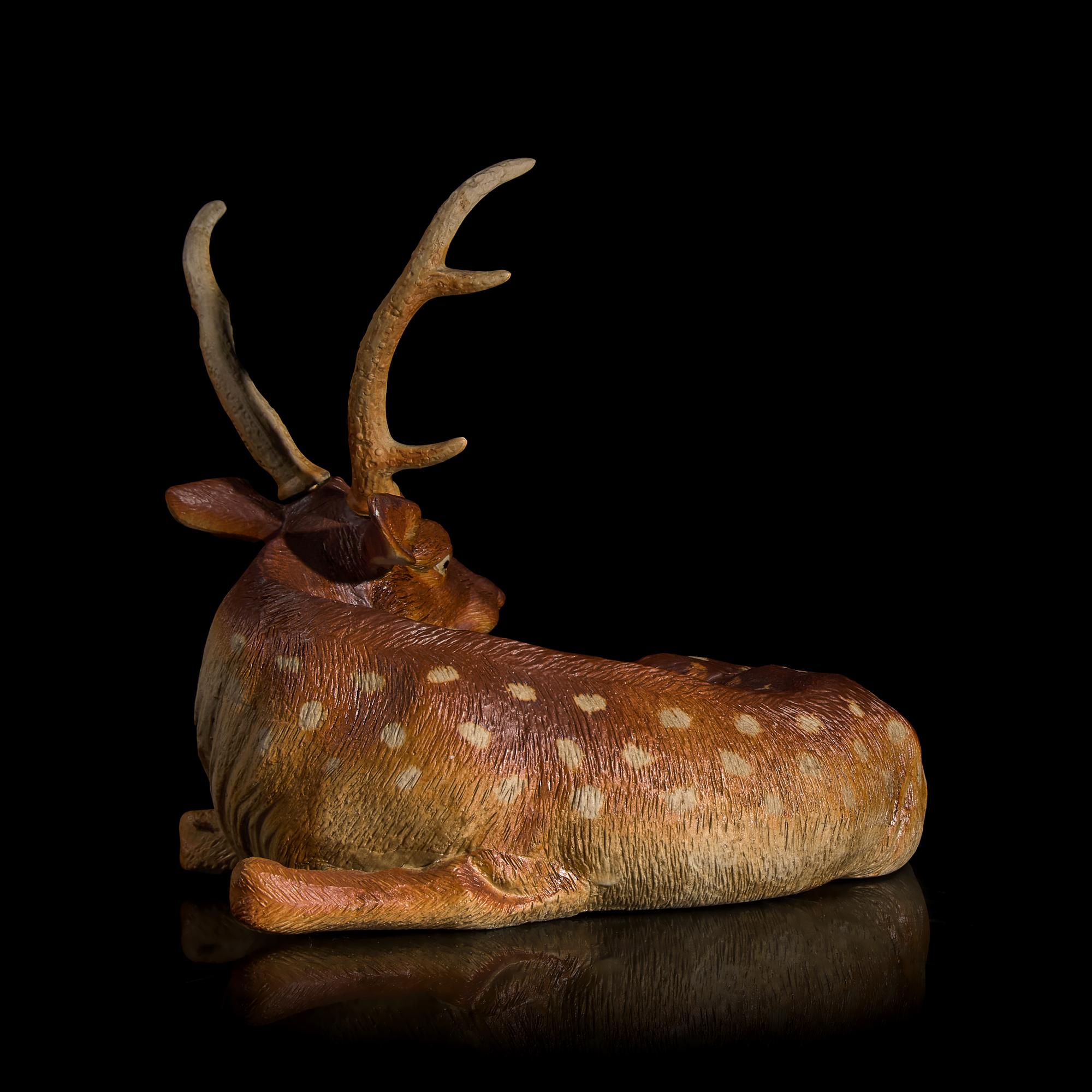 A Japanese Studio Ceramic Figure of a Recumbent Deer, Meiji/Taisho Period