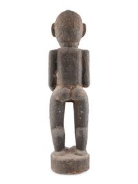 A Carved Wood and Black Painted Monkey Figure
