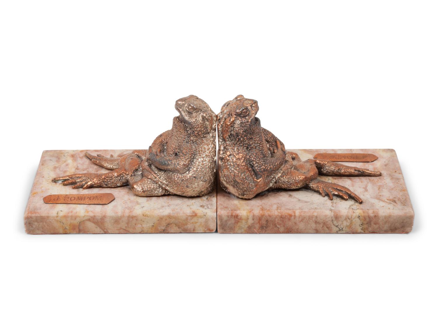 A Pair of Silvered Copper and Marble Bookends