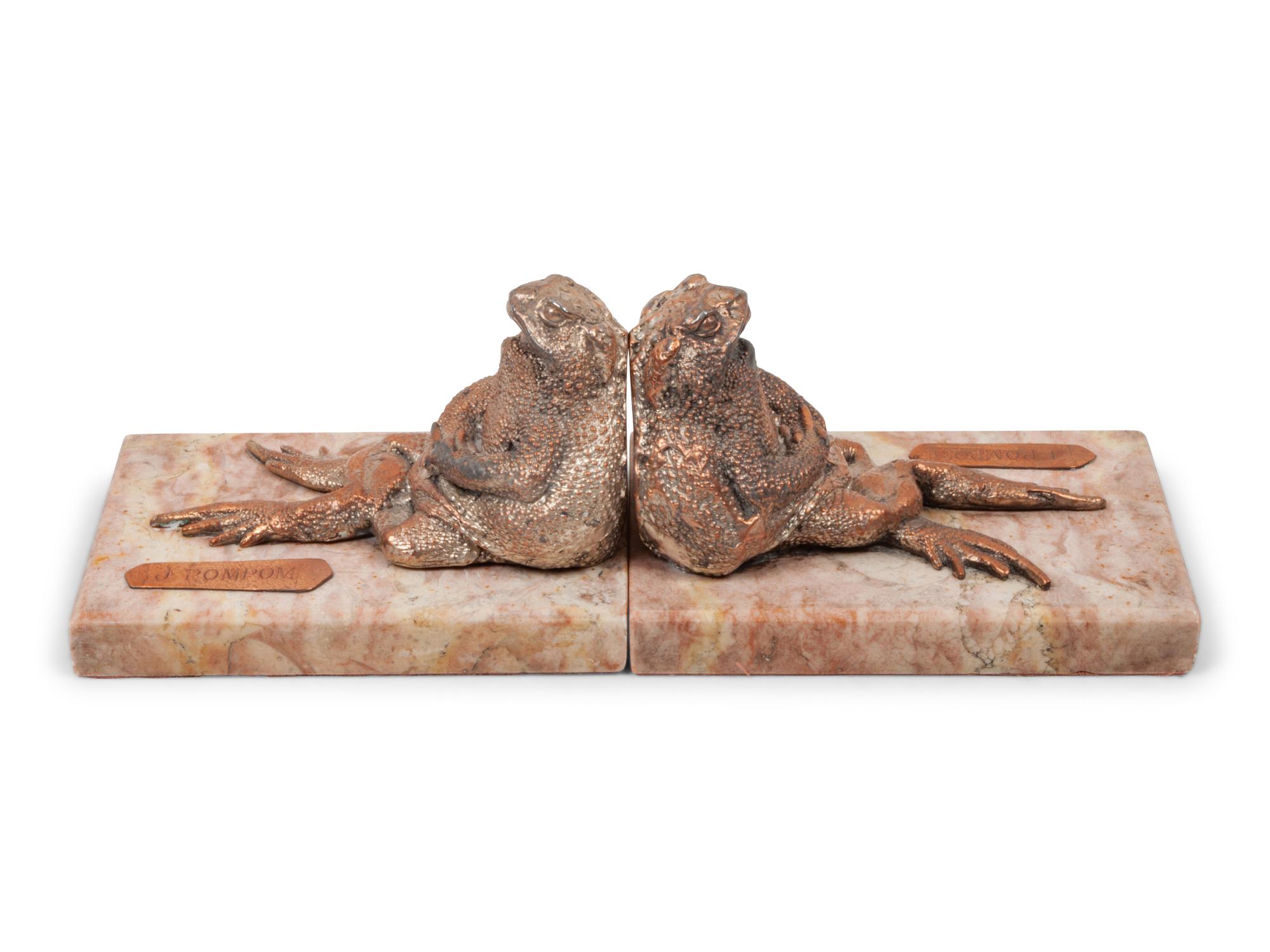 A Pair of Silvered Copper and Marble Bookends