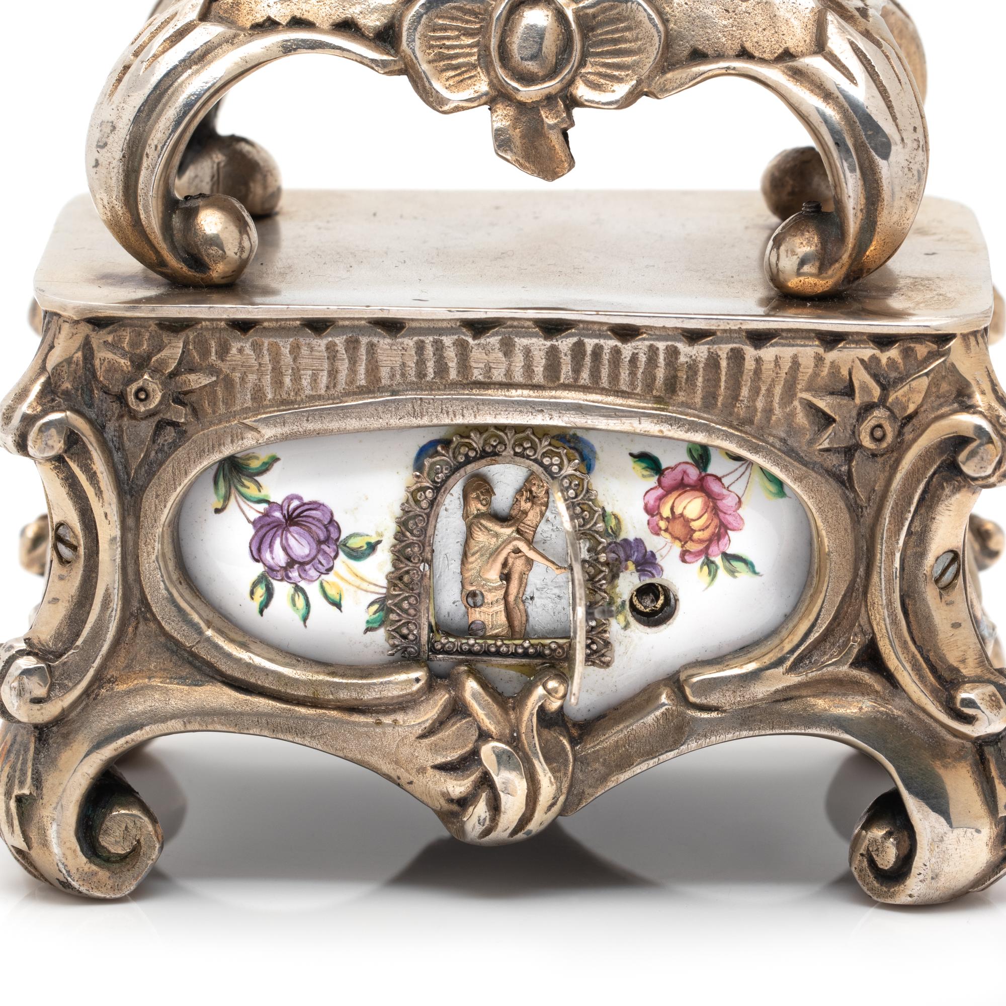 GILT-METAL AND ENAMEL CLOCK WITH HIDDEN AUTOMATON