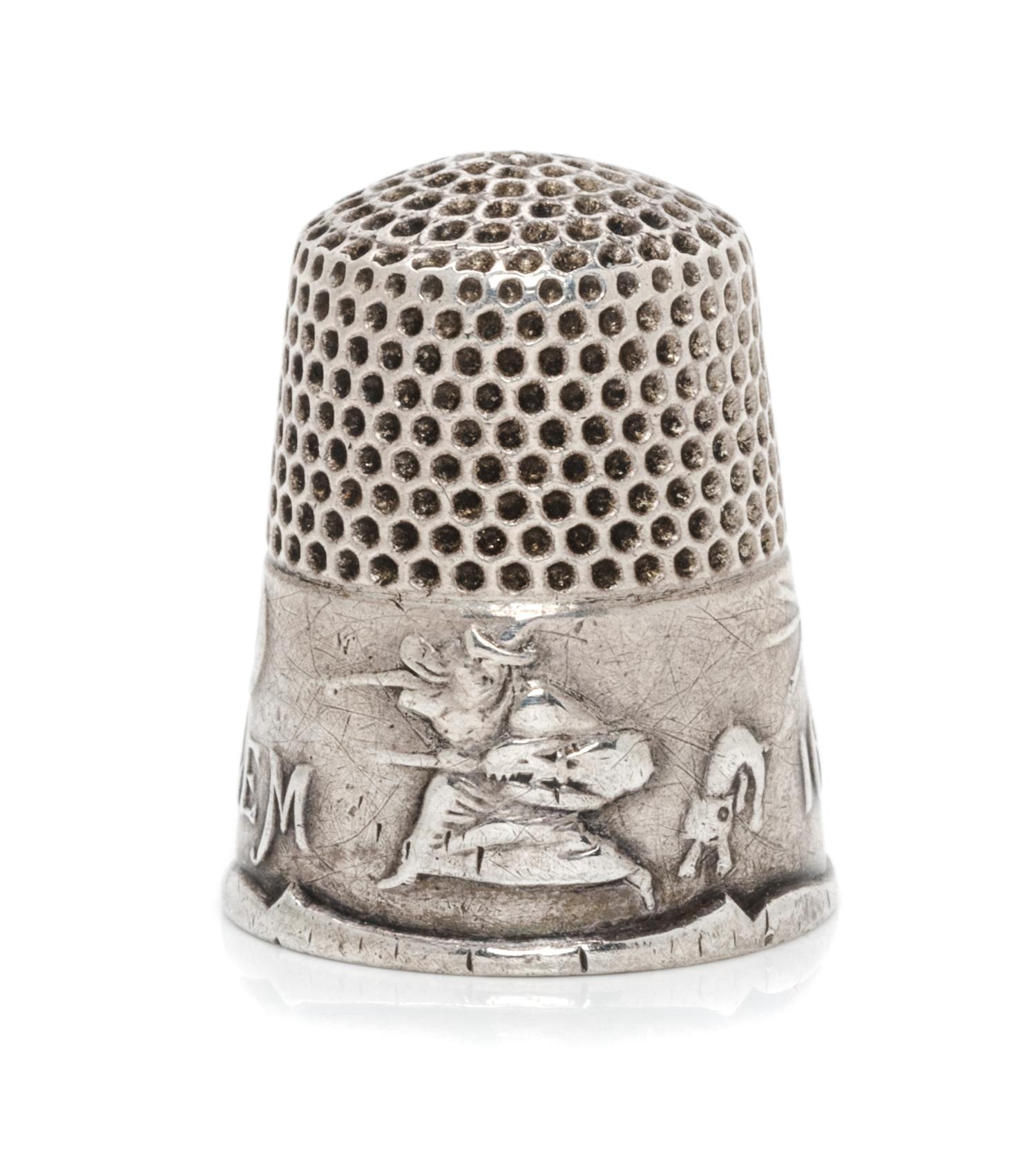 An American Silver Commemorative Thimble, Ketcham & McDougall, New York, NY, the dimpled top and body above a band commemorating the 16