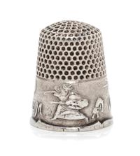 An American Silver Commemorative Thimble, Ketcham & McDougall, New York, NY, the dimpled top and body above a band commemorating the 16