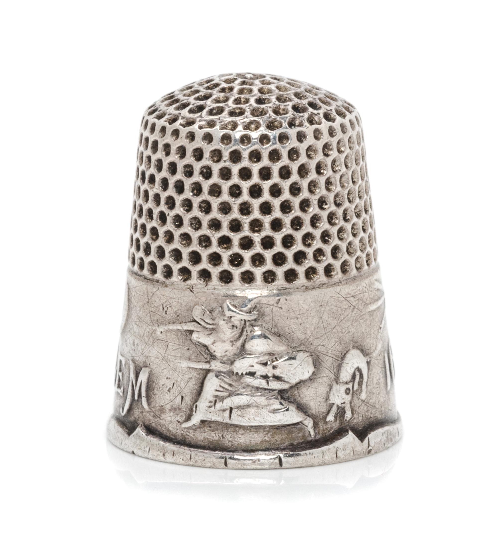 An American Silver Commemorative Thimble, Ketcham & McDougall, New York, NY, the dimpled top and body above a band commemorating the 16