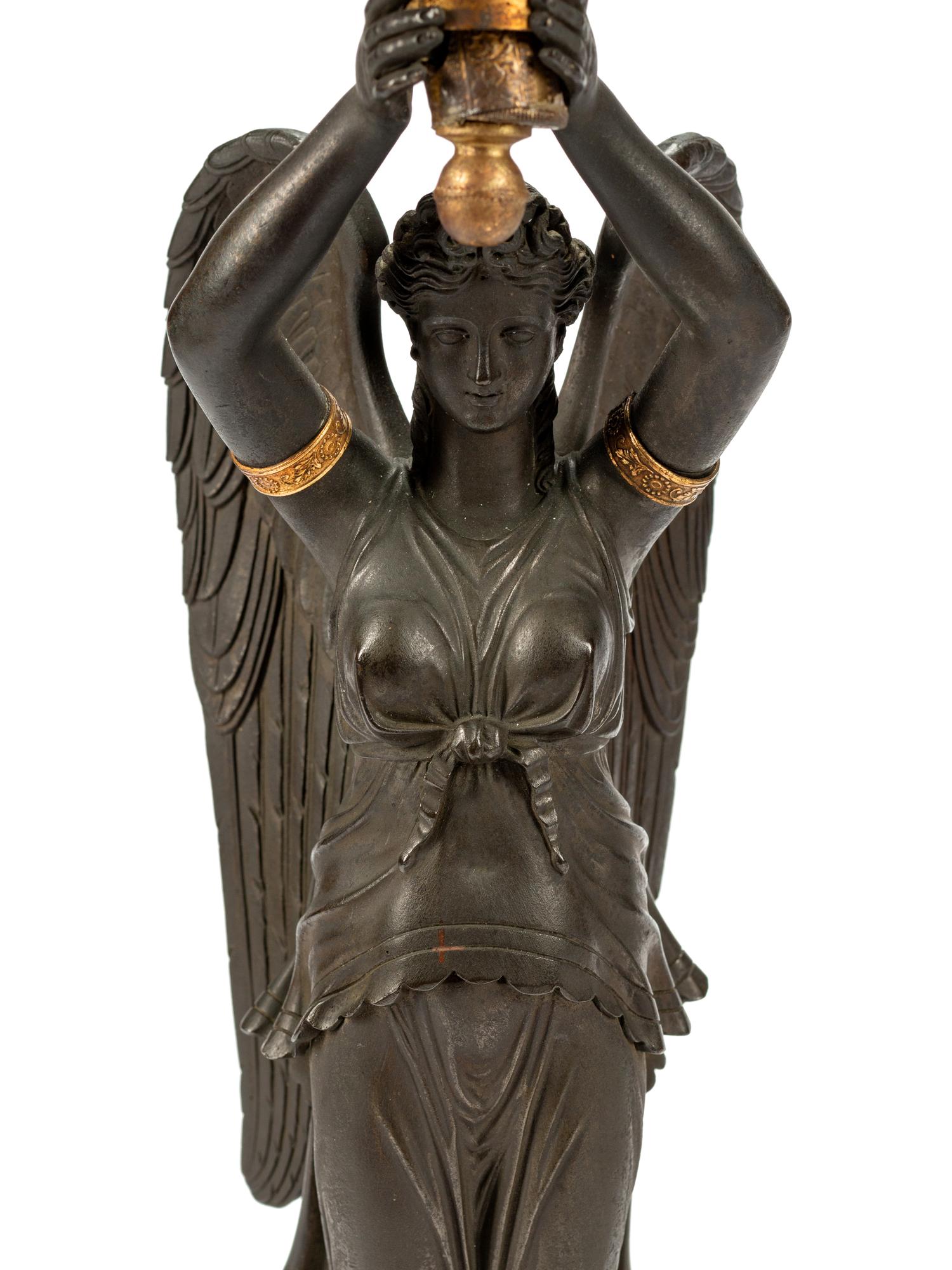 A Pair of Empire Style Gilt and Patinated Bronze and Tôle Six-Light Candelabra