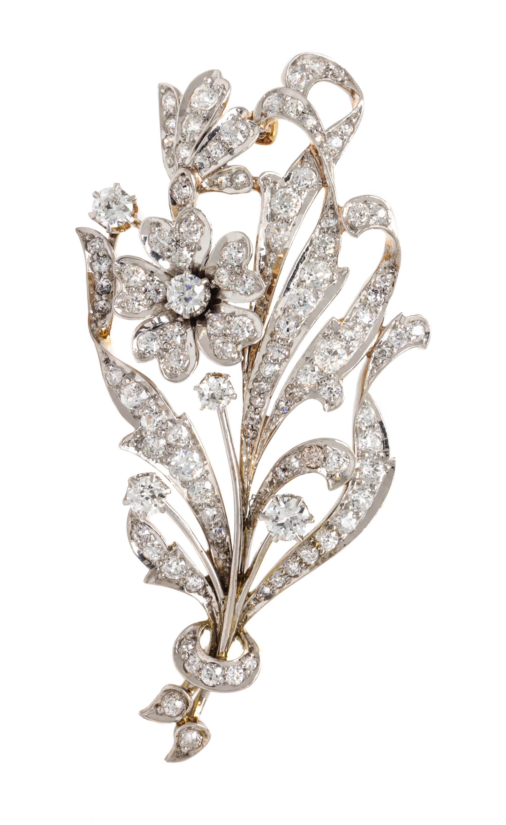 An Edwardian Platinum Topped Gold and Diamond Flower Brooch, 13.80 dwts.