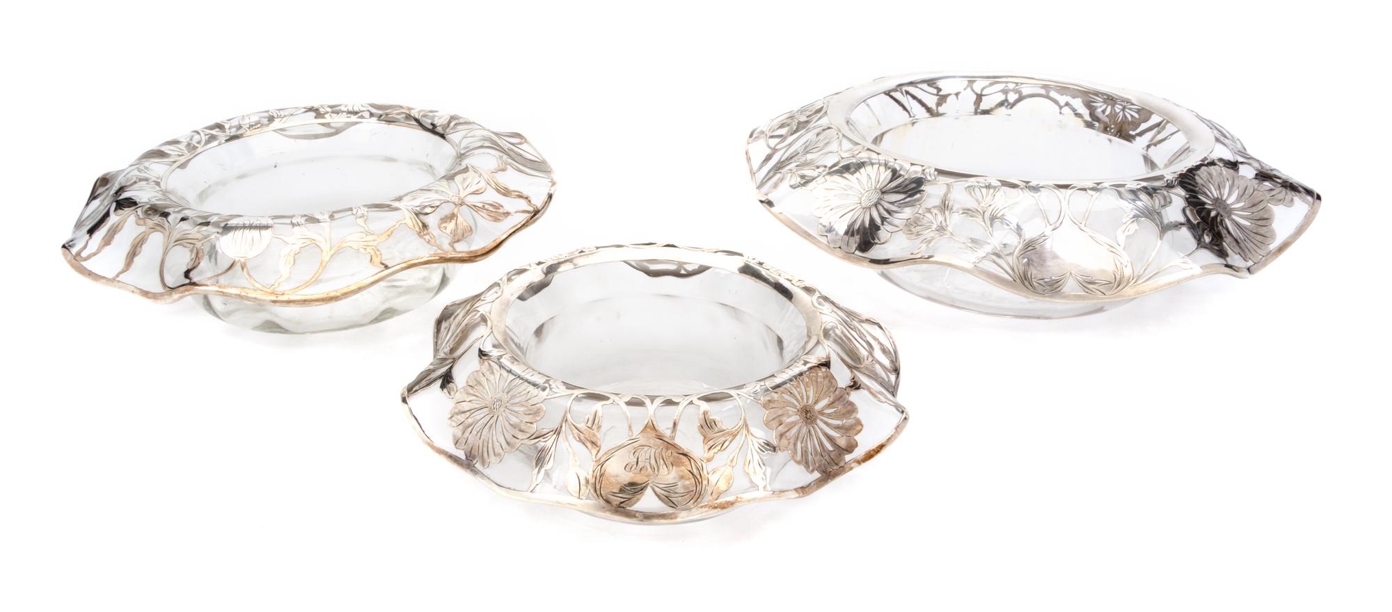 A Set of Three Graduated Silver Overlay Glass Bowls Diameter of largest 11 7/8 inches.