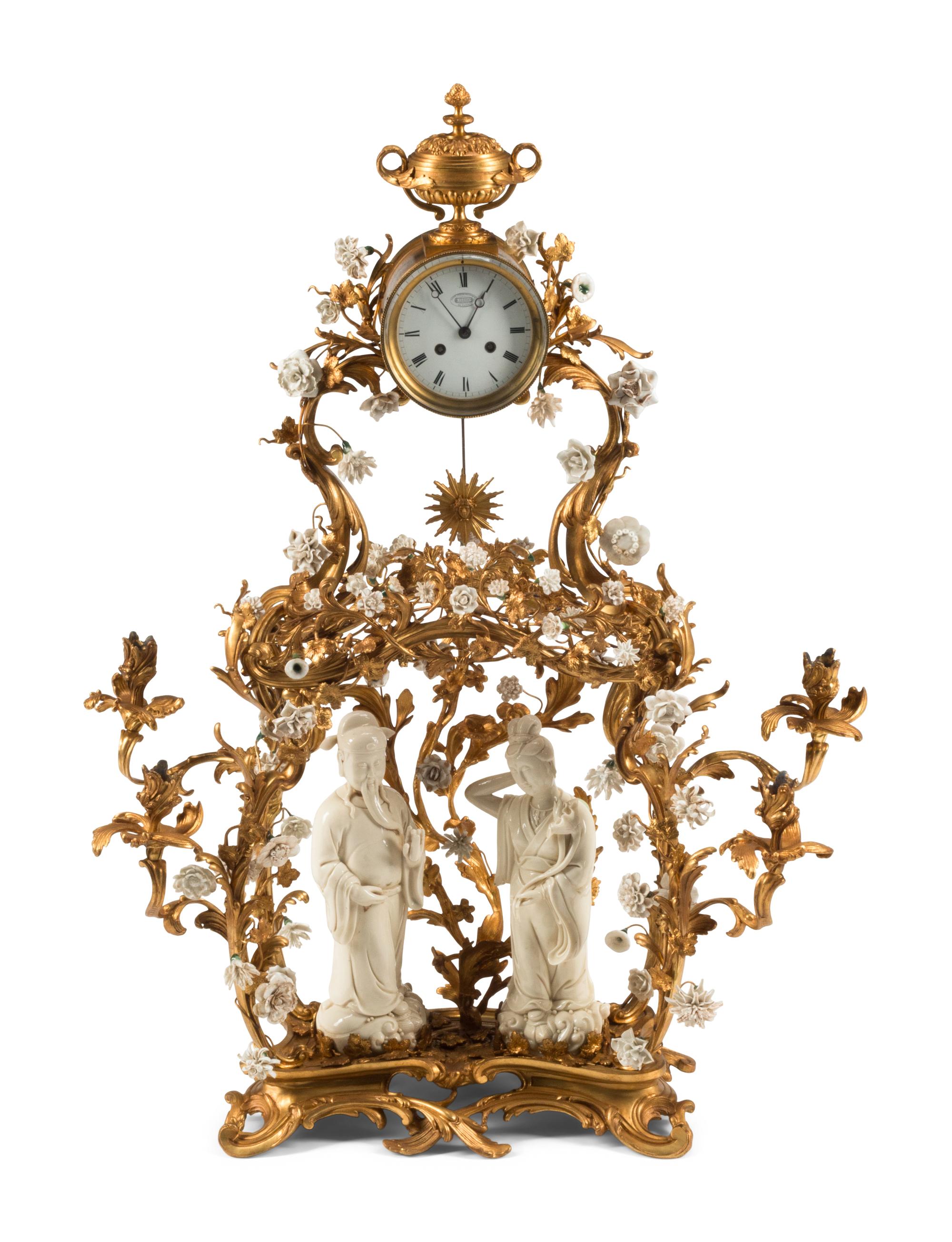 A Louis XV Style Porcelain Mounted Gilt Bronze Clock