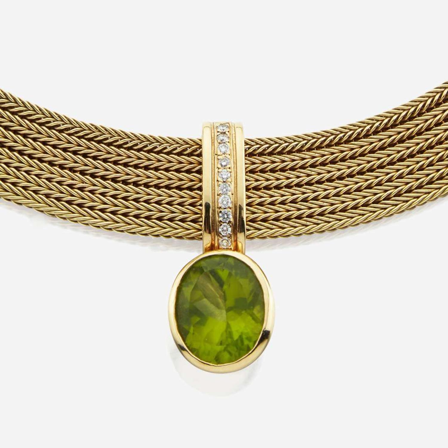 A peridot, diamond, and gold necklace