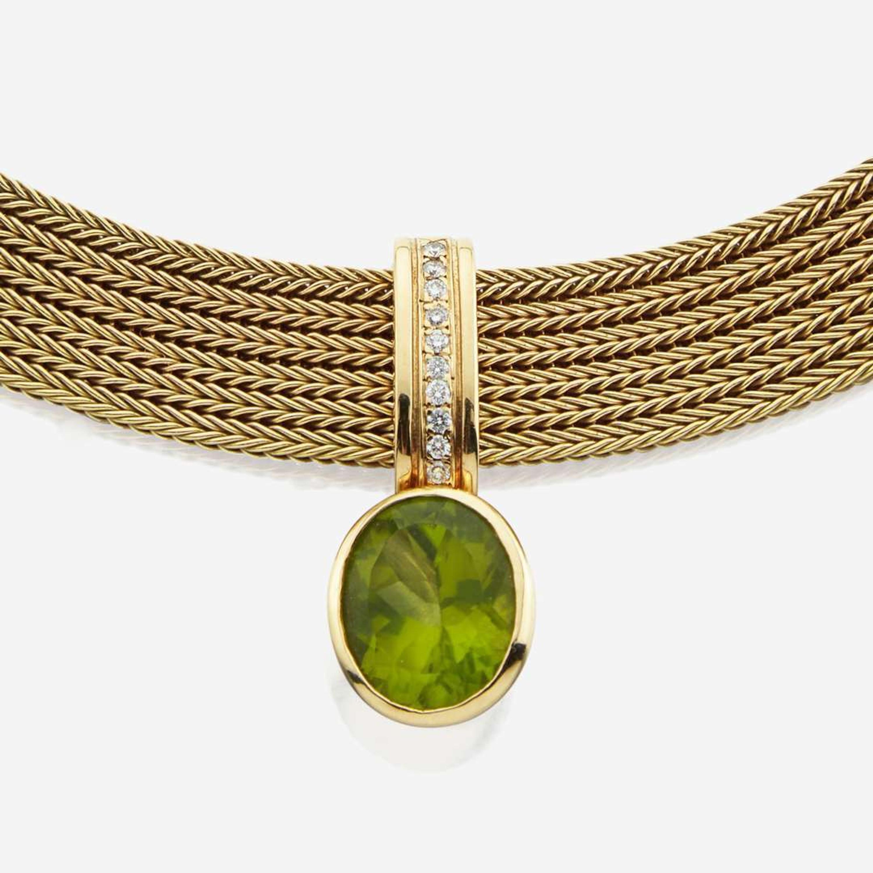 A peridot, diamond, and gold necklace