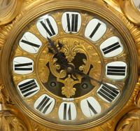 A Louis XV Style Gilt Bronze Clock Garniture