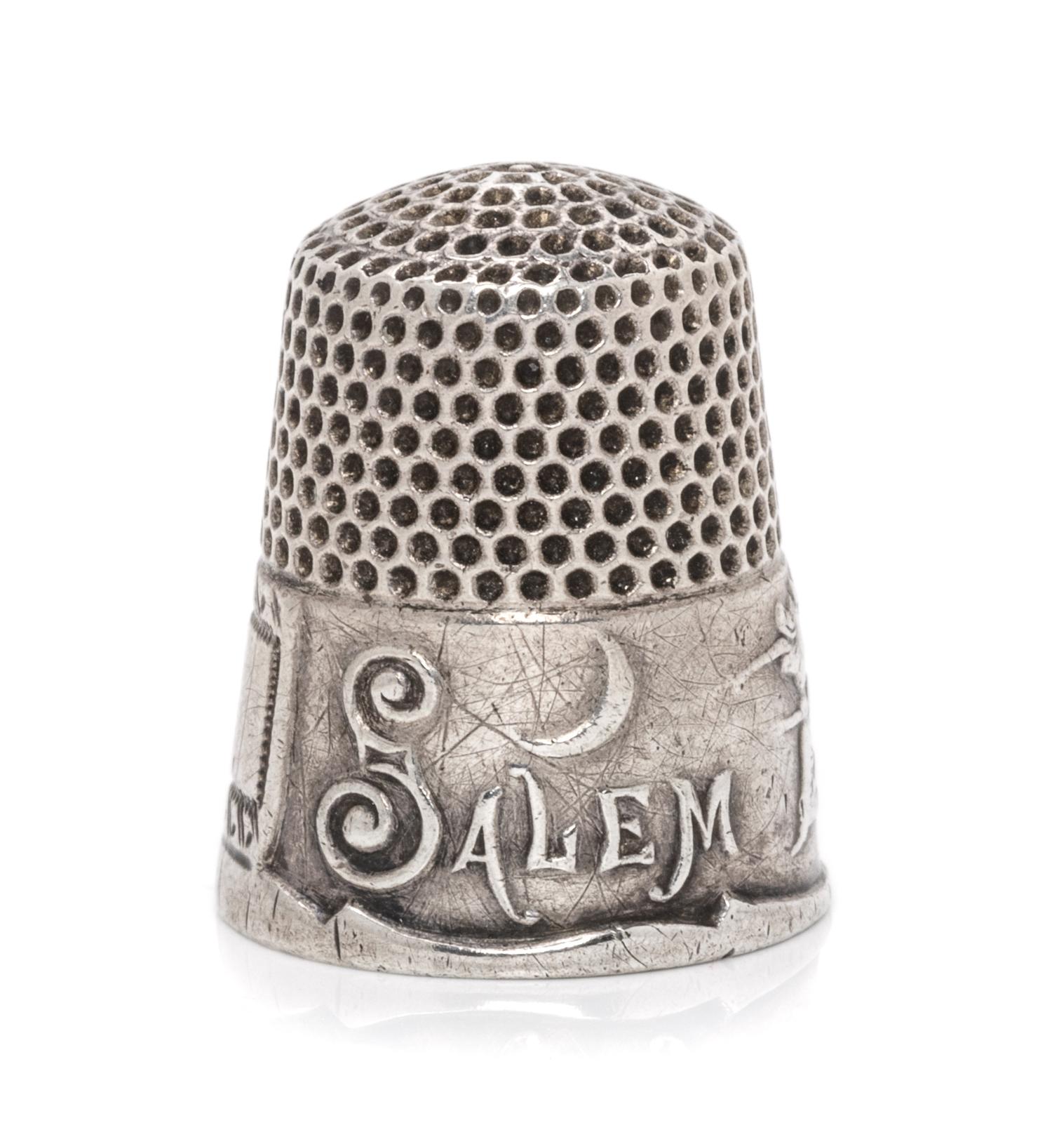 An American Silver Commemorative Thimble, Ketcham & McDougall, New York, NY, the dimpled top and body above a band commemorating the 16