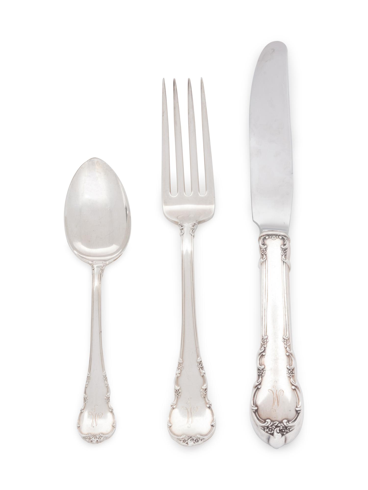 in the Modern Victorian pattern, comprising: 10 dinner knives with stainless steel blades 10 butter spreaders 10 dinner forks 9 salad forks 10 shrimp forks 1 pickle fork 20 teaspoons 10 soup spoons 2 iced tea spoons 82 pieces total.