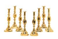 Four Pairs of English Brass Diamond Jubilee Candlesticks, Height of tallest 12 1/2 inches.