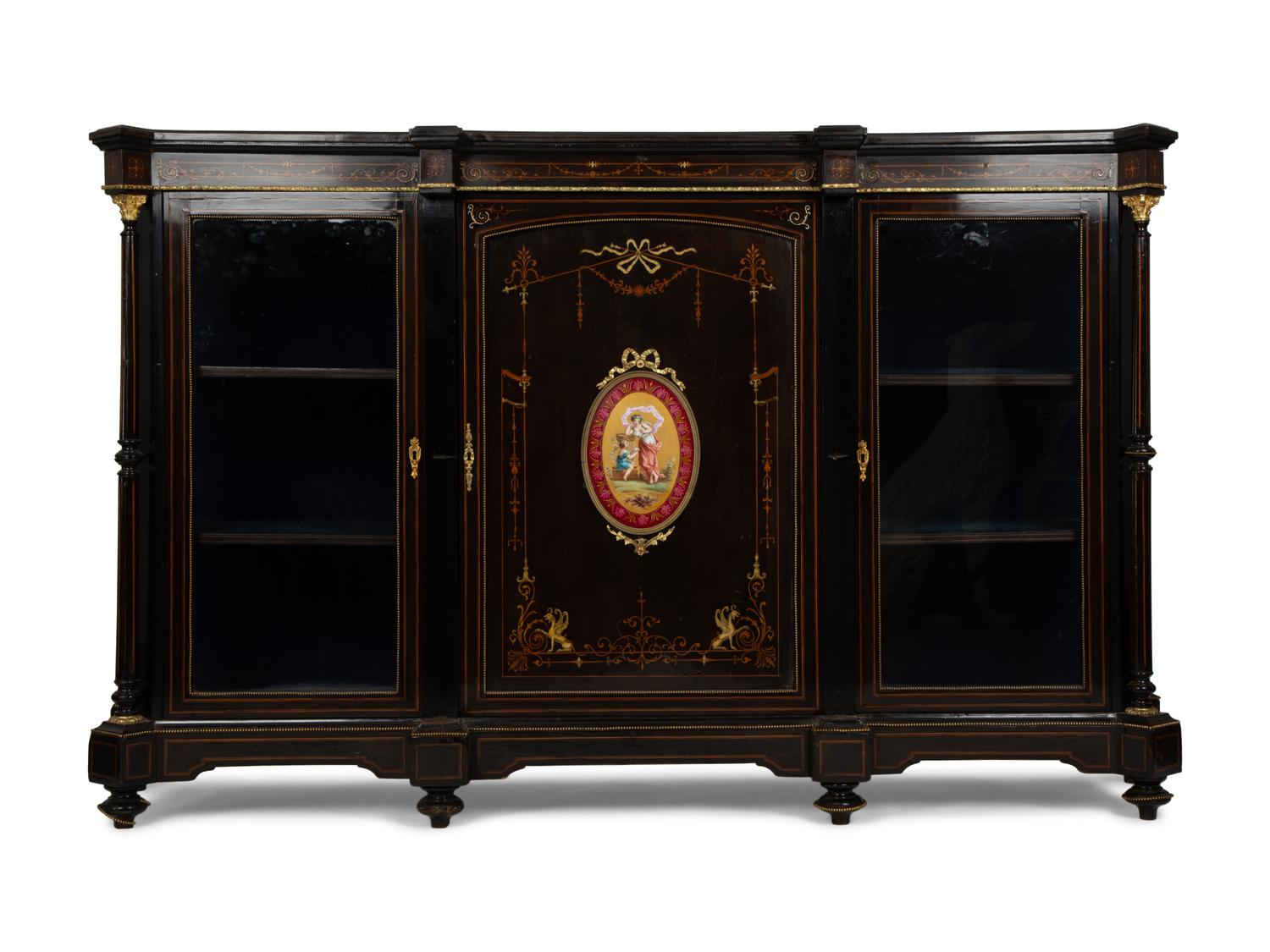 A Napoleon III Gilt Bronze and Porcelain Mounted Ebony and Marquetry Cabinet — CIRCA 1870