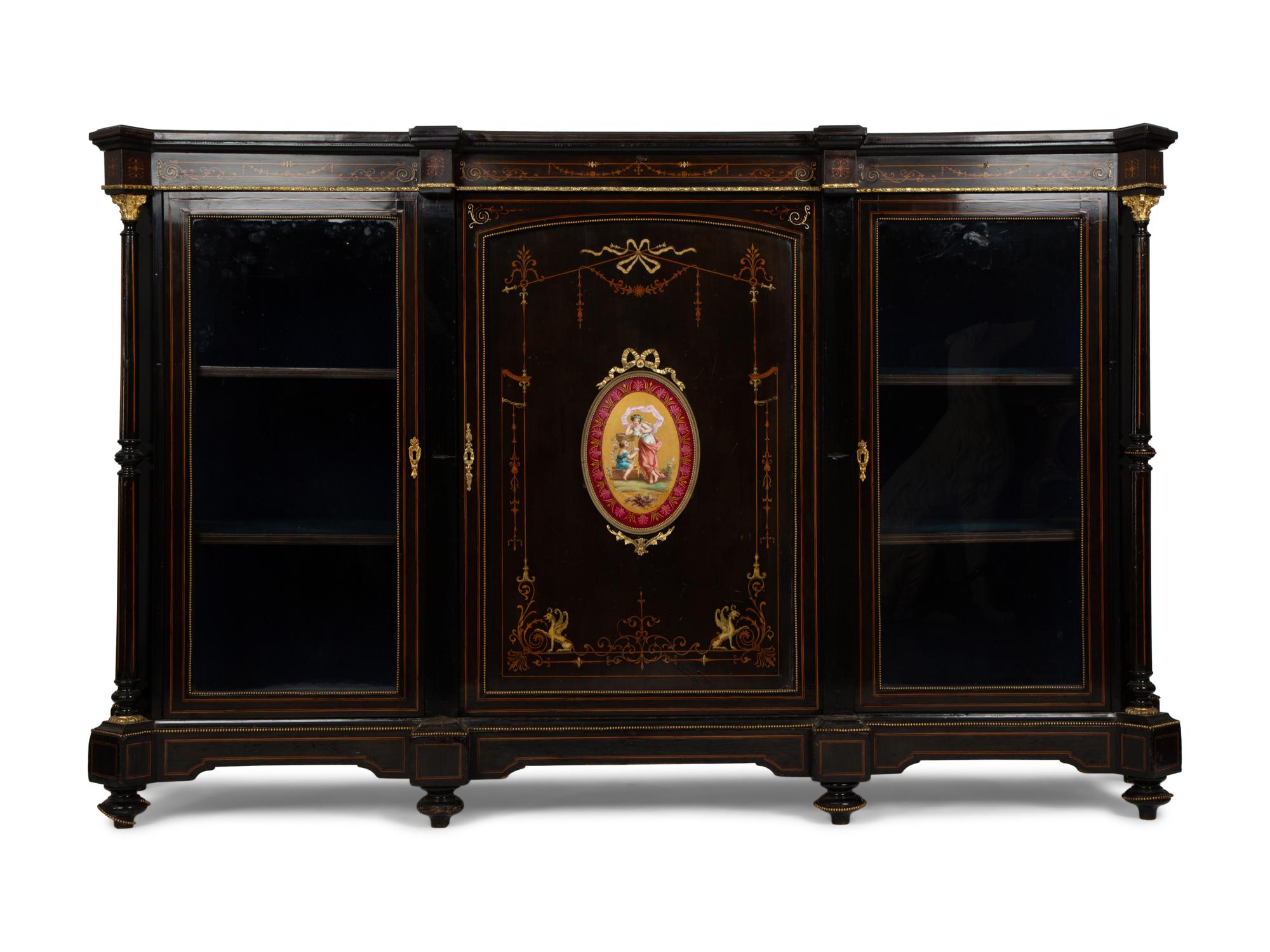 A Napoleon III Gilt Bronze and Porcelain Mounted Ebony and Marquetry Cabinet — CIRCA 1870