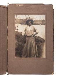 [EARLY PHOTOGRAPHY]. A group of 6 photographs of African American subjects, highlighted by lovely portrait of African American woman with white child.
