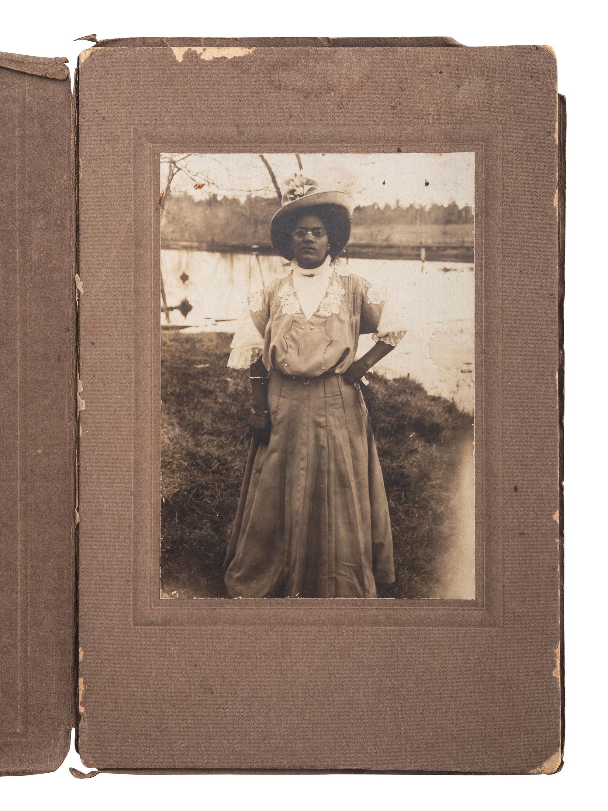 [EARLY PHOTOGRAPHY]. A group of 6 photographs of African American subjects, highlighted by lovely portrait of African American woman with white child.