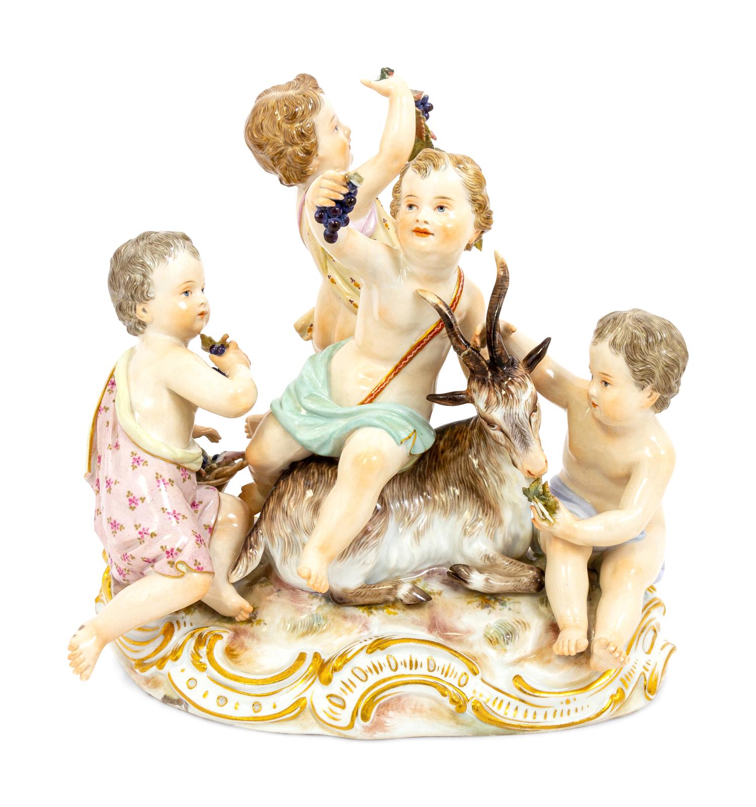 A Meissen Porcelain Group of Children Feeding a Goat
