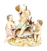 A Meissen Porcelain Group of Children Feeding a Goat