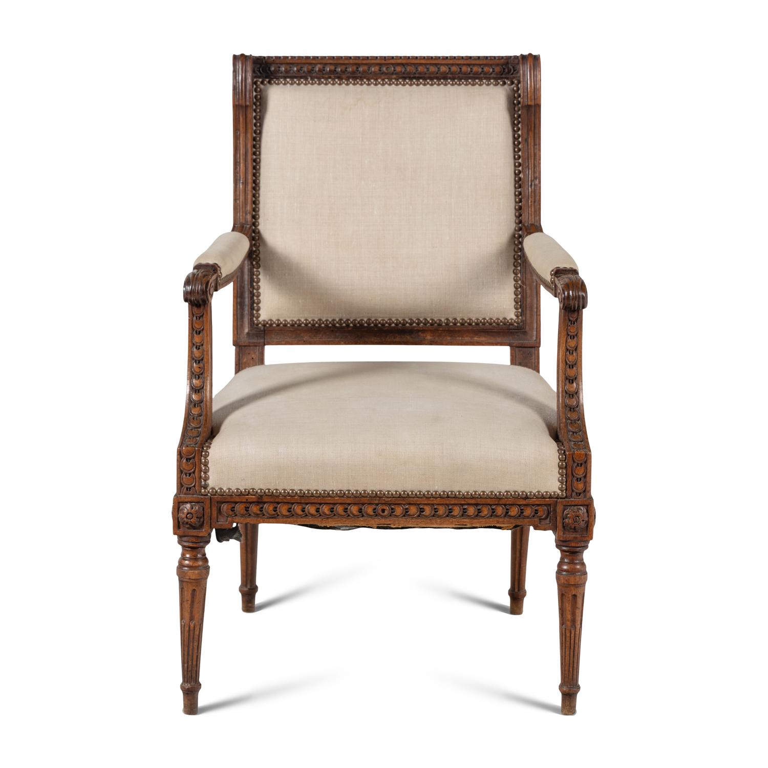 A Louis XVI Carved Walnut Fauteuil