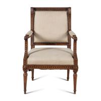 A Louis XVI Carved Walnut Fauteuil