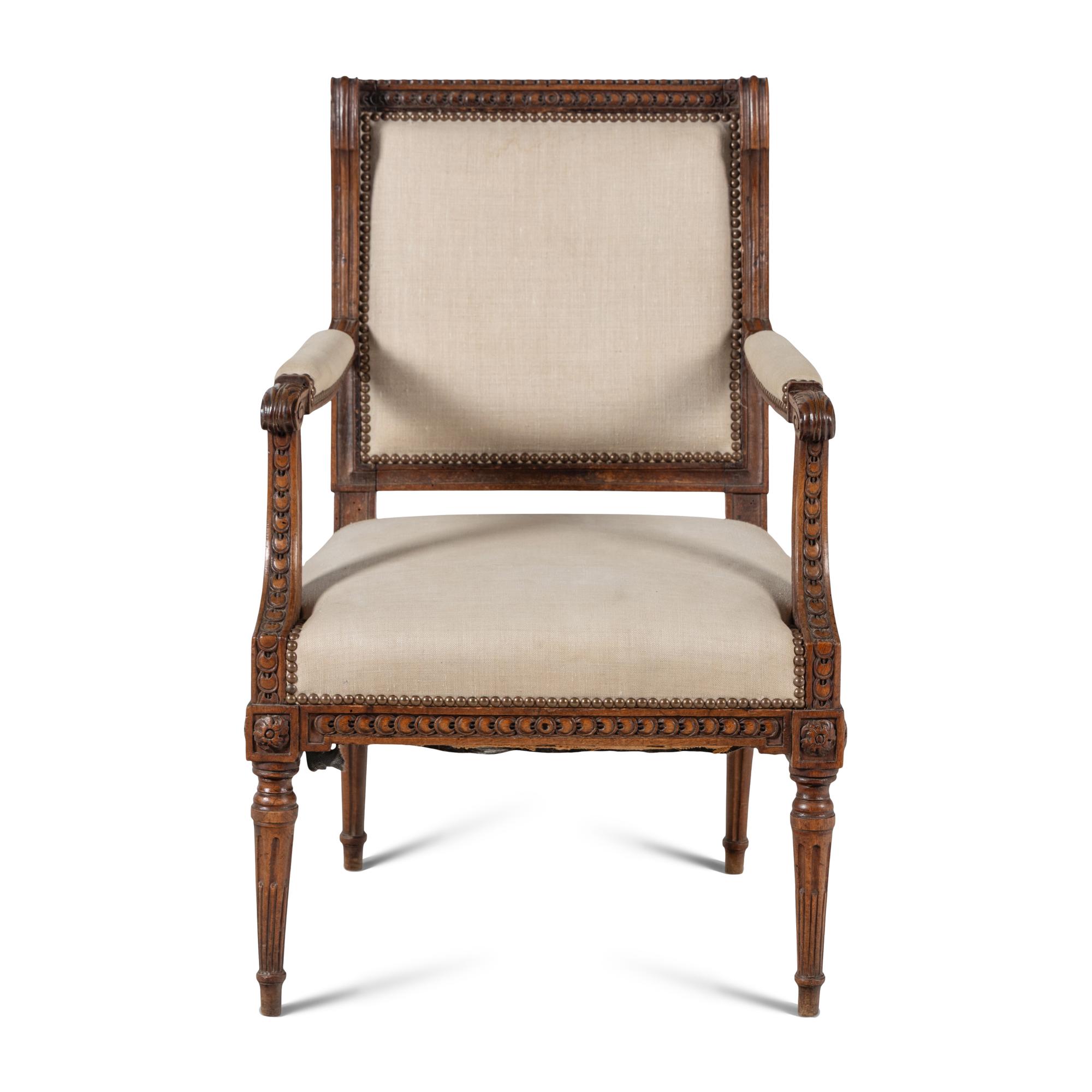A Louis XVI Carved Walnut Fauteuil