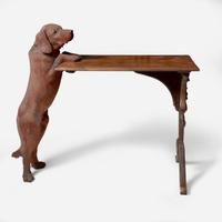A Black Forest carved walnut and rosewood table with English Labrador Eduard Binder, Brienz, Switzerland, late 19th / early 20th century