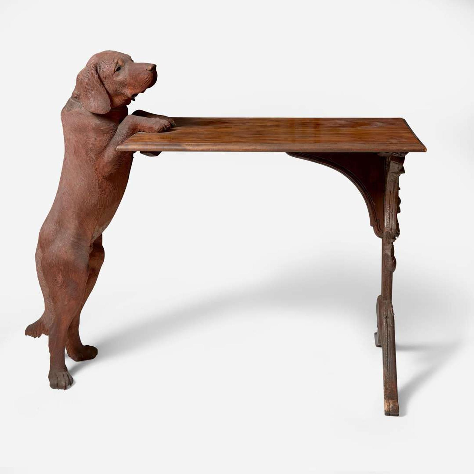 A Black Forest carved walnut and rosewood table with English Labrador Eduard Binder, Brienz, Switzerland, late 19th / early 20th century