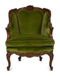 A Louis XV Style Carved Fruitwood Bergère à Oreilles