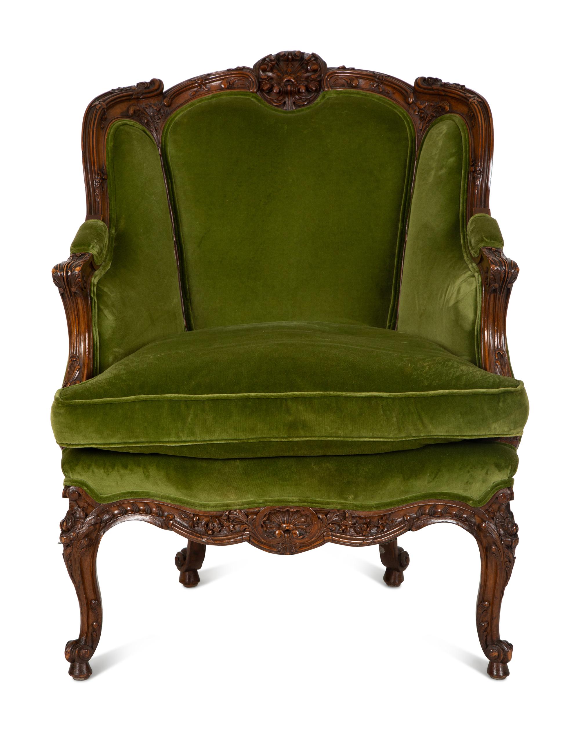 A Louis XV Style Carved Fruitwood Bergère à Oreilles