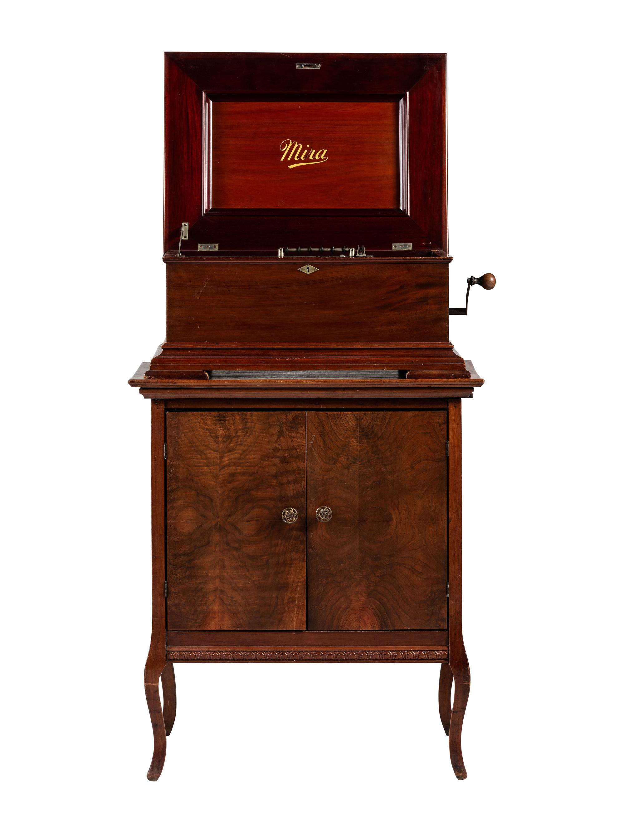 A Mira Mahogany-Cased Disc Music Box and Cabinet